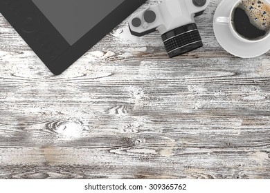 camera and coffee on table, workplace, top view