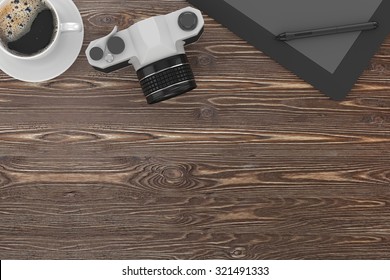 camera and coffee on table, workplace, top view