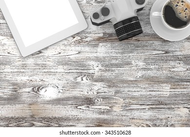 camera and coffee on table, workplace, top view