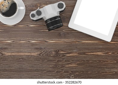camera and coffee on table, workplace, top view
