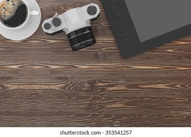camera and coffee on table, workplace, top view