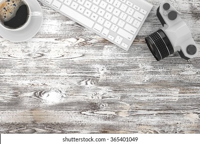 camera and coffee on table, workplace, top view