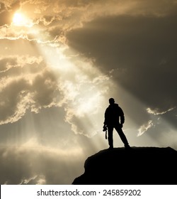 Cameraman Silhouette Standing On Cliff With God Light And Sky And Cloud Background,employee Waiting Command From Leader