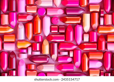 A captivating display of assorted lipsticks, presenting a plethora of shades from subtle pinks to bold reds, in a mix of matte, glossy, and satin finishes for various beauty looks. - Powered by Shutterstock