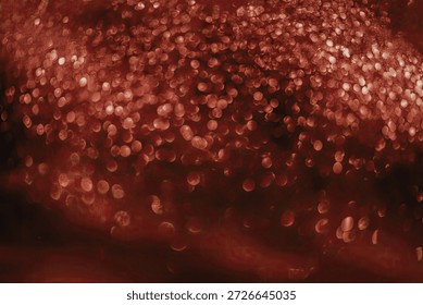 A captivating image of cascading red bokeh lights creating a mesmerizing effect. The lights are scattered in a soft, blurred manner, evoking a sense of warmth and depth.
