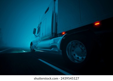 Captured at night, this image shows a semi-truck with bright red safety lights moving cautiously along a fog-enshrouded highway, its path lit by reflective road markings. - Powered by Shutterstock