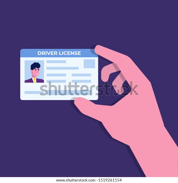 Car driver\
license in hand.Holding the id\
card.