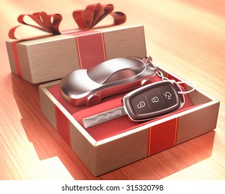 Car key inside a gift box with a red ribbon tied up on the cover. Depth of field with focus on the key button.