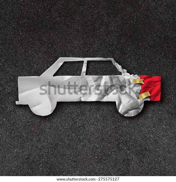 Car repair accident symbol and automobile\
crash fix concept on an asphalt road with  white crumpled paper\
shaped as a damaged and dented auto as an icon of insurance and\
mechanic repairing.