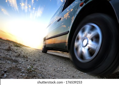 Car And Speed. Sunset Scenery And Fast Car Outdoor