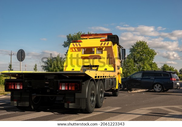 Car tow truck on the road in a place\
crash.Tow Car  are generic-3d\
illustration.