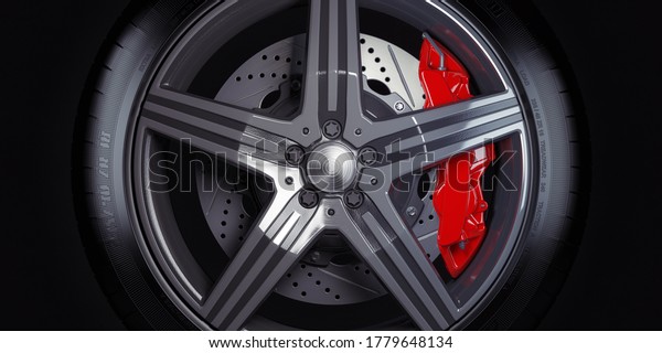Car wheel with red breaks on black\
background. 3d\
illustration