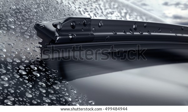 Car windshield with rain drops and frameless wiper\
blade closeup. 3d\
render