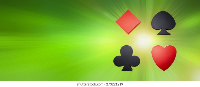 Card Game. Poker - Hearts, diamonds, crosses, peaks, on a green background, motion - Powered by Shutterstock