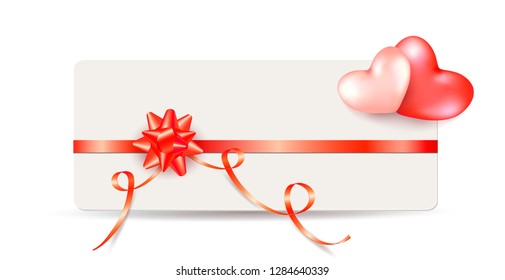 Card note with shiny red bow and ribbons with two hearts