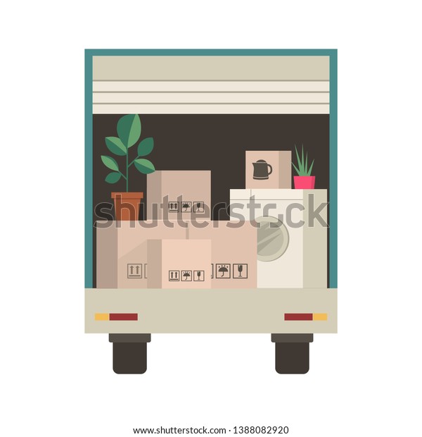 Cardboard boxes and packed\
household stuff in van - moving to a new house or office. Things\
inside truck
