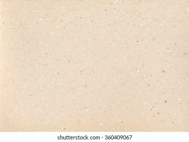 Cardboard texture. Vintage backdrop. Carton paper. Brown Grungy background. aged old macro Kraft with dots and strikes.
