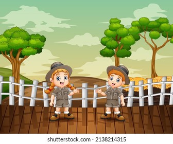 Cartoon Illustration Of Zookeeper Boy And Girl In The Open Zoo