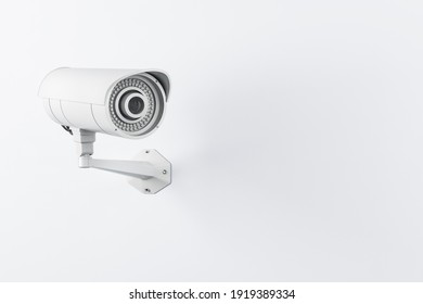 CCTV videocam installed on light wall, security concept. 3D rendering