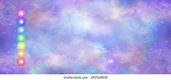 Celestial Sky Chakra Vortex message banner - a neat stack of seven rainbow coloured chakra vortexes on left side  against a beautiful heavenly sky background with copy space
