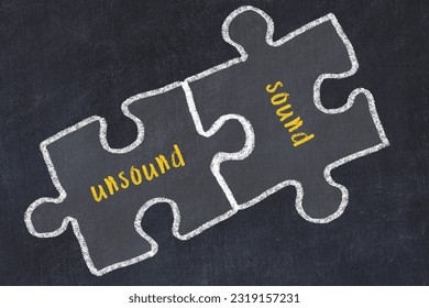 Chalk drawing of two puzzles with words unsound and sound. Concept of solving problems