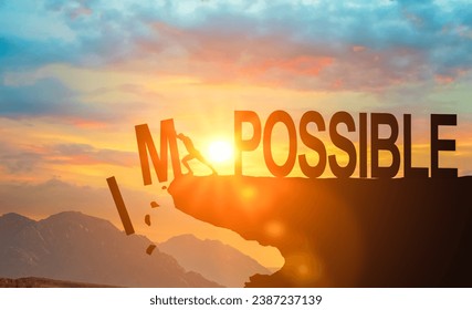 Changing impossible to possible. man pushes letters i and m down changing word impossible to possible. Positive thinking mindset, success and challenge. Motivation concept. Nothing is impossible