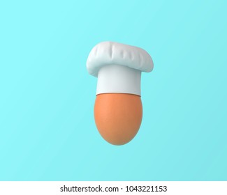 Chef Hat With Egg Concept On Pastel Blue Background. Minimal Idea Food And Fruit Concept. Creative To Produce Work Within An Advertising Marketing Communications Or Artwork Design. Easter Day