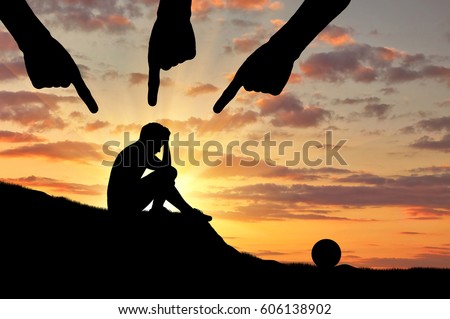 Child abuse and violence. Silhouette of a sad boy and hands of an adult people pointing at him Stock photo © 