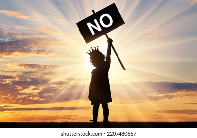 Childish Selfishness. Girl Child Egoist With A Crown On His Head Holds A Poster With The Word No. The Concept Of Selfish Behavior Among Children. Silhouette