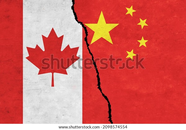 China and Canada painted flags on a wall with a\
crack. China and Canada\
relations