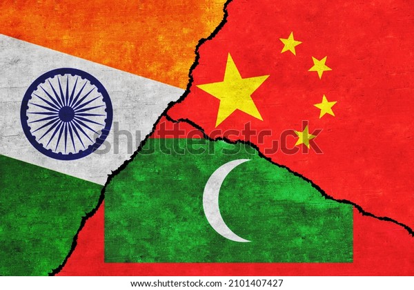 China, India and Maldives\
painted flags on a wall with a crack. India, China and Maldives\
relations