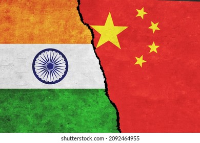 China and India painted flags on a wall with a crack. China and India conflict. India and China flags together. China vs India