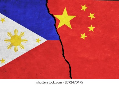 China and Philippines painted flags on a wall with a crack. China and Philippines conflict. Philippines and China flags together. China vs Philippines