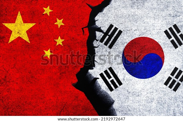 China vs South Korea concept flags on a\
wall with a crack. South Korea and China political conflict, war\
crisis, economy, relationship, trade\
concept
