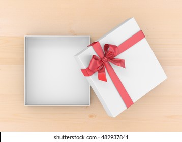 Christmas And New Year's Day ,Open Red Gift Box Top View On Table Background 3d Rendering 