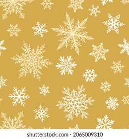 Christmas seamless pattern of complex big and small snowflakes in white colors on light brown background