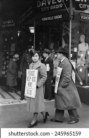 CIO (Congress of Industrial Organizations) strikers pickets a store in the Yorkville neighborhood of Manhattan. Dec. 1937.