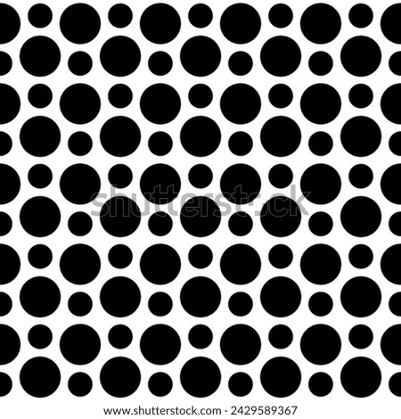 Circle pattern in rows alternating small and large, endless, abstract, monotone, black and white, background.