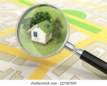 City building in tne magnifier. House search concept.