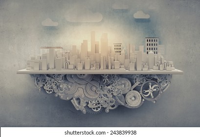 City construction model with cogwheel mechanism on grunge background