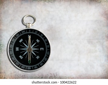 Classic compass on grunge paper  background.