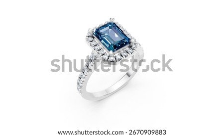 Classic silver ring featuring vivid blue emerald-cut gemstone with dazzling diamond accents. Stylish luxury jewelry isolated on white background.