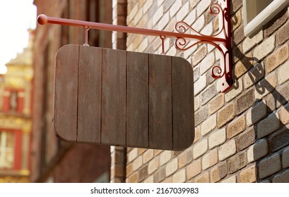 Classic Wooden Wall Sign Board Mockup Hung On A Store Facade. Blank Outdoor Business Signage Template For Branding In Realistic 3D Rendering