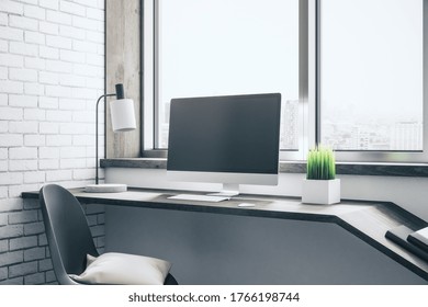 Clean designer desktop with empty computer screen, lamp on table and city view. Workplace and lifestyle concept. Mock up, 3D Rendering