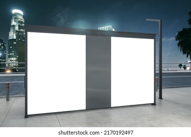 Clean White Bus Stop Billboard On Blurry Night City Backdrop. Commercial And Ad Concept. Mock Up, 3D Rendering