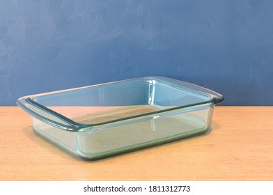 Clear Glass Baking Dish, Rectangular Shape On The Wooden Table. 3D Rendering