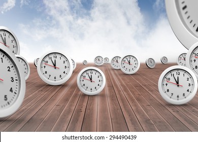 Clocks against cloudy sky background
