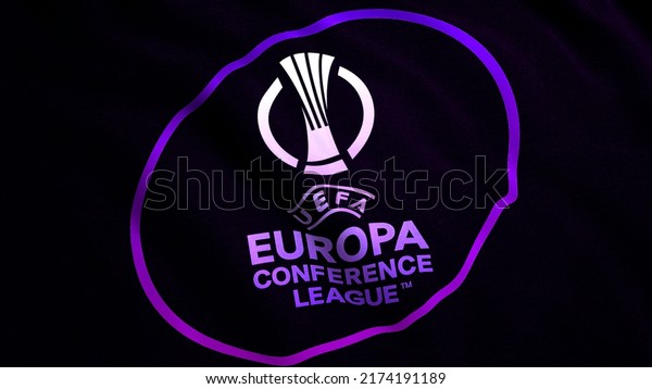 Close up of an abstract emblem of the UEFA Europa\
Conference League. Motion. Waving realistic background. For\
editorial use\
only.