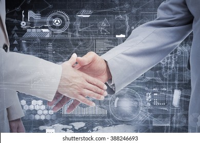Close up of business people shaking their hands against hologram background