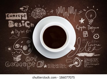 Close up of cup of coffee on table with sketches on background Arkistokuvituskuva